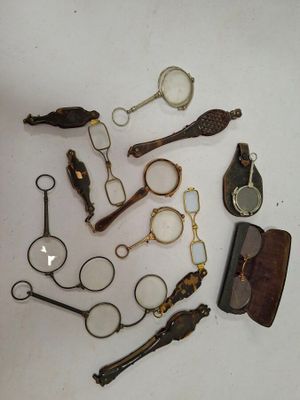 many different types of glasses and other items on the table
