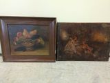 two framed paintings of fruit on a table next to a wall