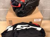 two helmets and a bag are sitting on top of a box