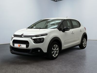 a white citrole is parked in a white room