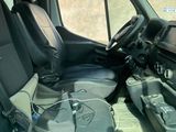 a picture of the inside of a truck with the driver ' s seat up