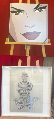 a picture of a woman that is standing next to a painting