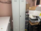 an image of a room that has a refrigerator and a table in it
