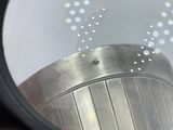 a close up of a magnifying glass with a building in the background