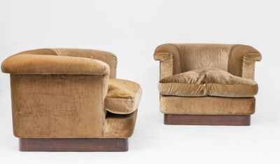 pair of mid - century style lounge chairs in velvet upholstered with wooden legs