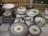 a lot of plates and bowls on the table