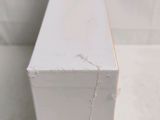a close up of a piece of wood that has been painted white