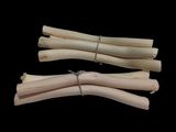three pieces of wood that are on a black surface