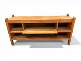 a wooden bench with two shelves on it