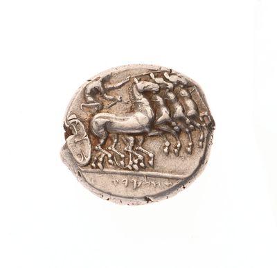 une image représentant une pièce d'argent sur laquelle figurent un cheval et son cavalier
