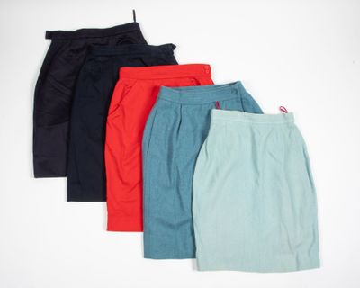 five pairs of women ' s shorts are lined up against a white background