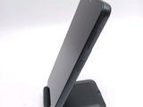 a cell phone that is sitting on top of a stand