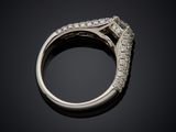 a close up of a diamond ring on a black surface