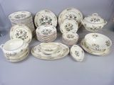 many different types of china dishes and cups on the table