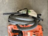 a tool box with a hose and other items on it