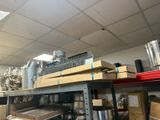 a room with a bunch of boxes and a bunch of pipes