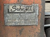 a metal box with a sign on it sitting on a table