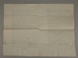 a piece of paper with writing on it sitting on top of a table