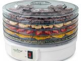 an image of a food dehyzer with strawberries and other ingredients