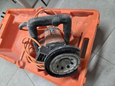 an orange box with a blower on top of it