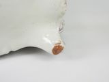 porcelain figurine of a white pig with a brown spot on its nose