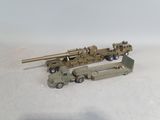 a toy truck with a gun on the back of it