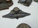 a lot of old metal items that are on a table