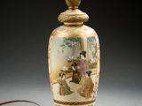 a lamp that has a picture of a woman on it