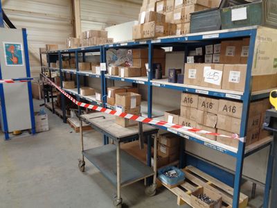 many boxes on the shelves in the warehouse