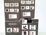 three boxes of electronic gadgets are stacked on top of each other