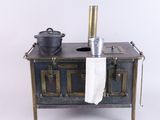a small stove with a pot on top of it