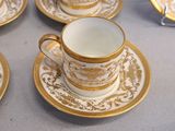 four cups and saucers sitting on a table