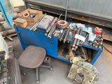 a blue workbench with tools on it in a garage