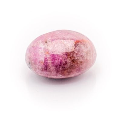 a close up of a pink stone egg on a white background