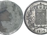 a close up of a coin with a crown on top of it