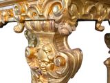 a gold table with a marble top on a white background