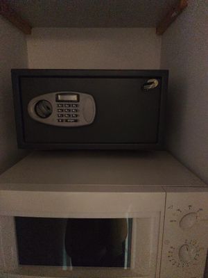 a small safe box in the corner of a small room