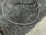 a black and white photo of a floor with a hose on it