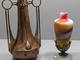 two vases that are sitting next to each other on a table