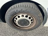 a close up of a tire on the side of a car