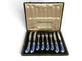 six forks and a knife in a black case