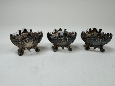 three antique silverplated dishes on stands