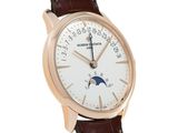 a close up of a wrist watch with a white dial and brown leather strap