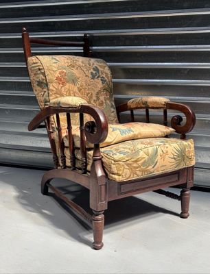 a chair that is sitting in front of a wall
