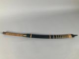 a black and gold pen sitting on top of a white table