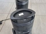two trash cans sitting on the floor next to each other