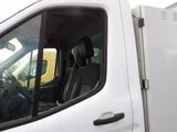 a white truck with the door open and the driver ' s seat down