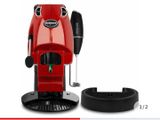 an image of a red coffee machine sitting on top of a table