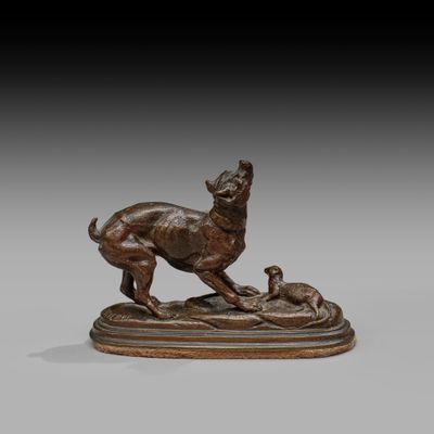 a bronze statue of a dog and a cat on a base