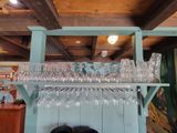 a shelf with wine glasses on it in a room
